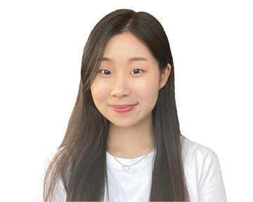 A young woman with long hair wearing a white shirt