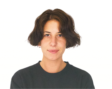 A woman with short hair wearing a black t-shirt