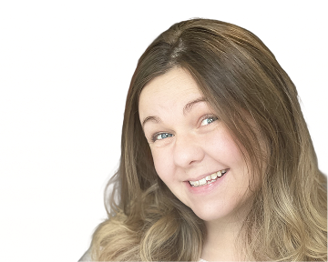 A woman with long hair smiles warmly at the camera